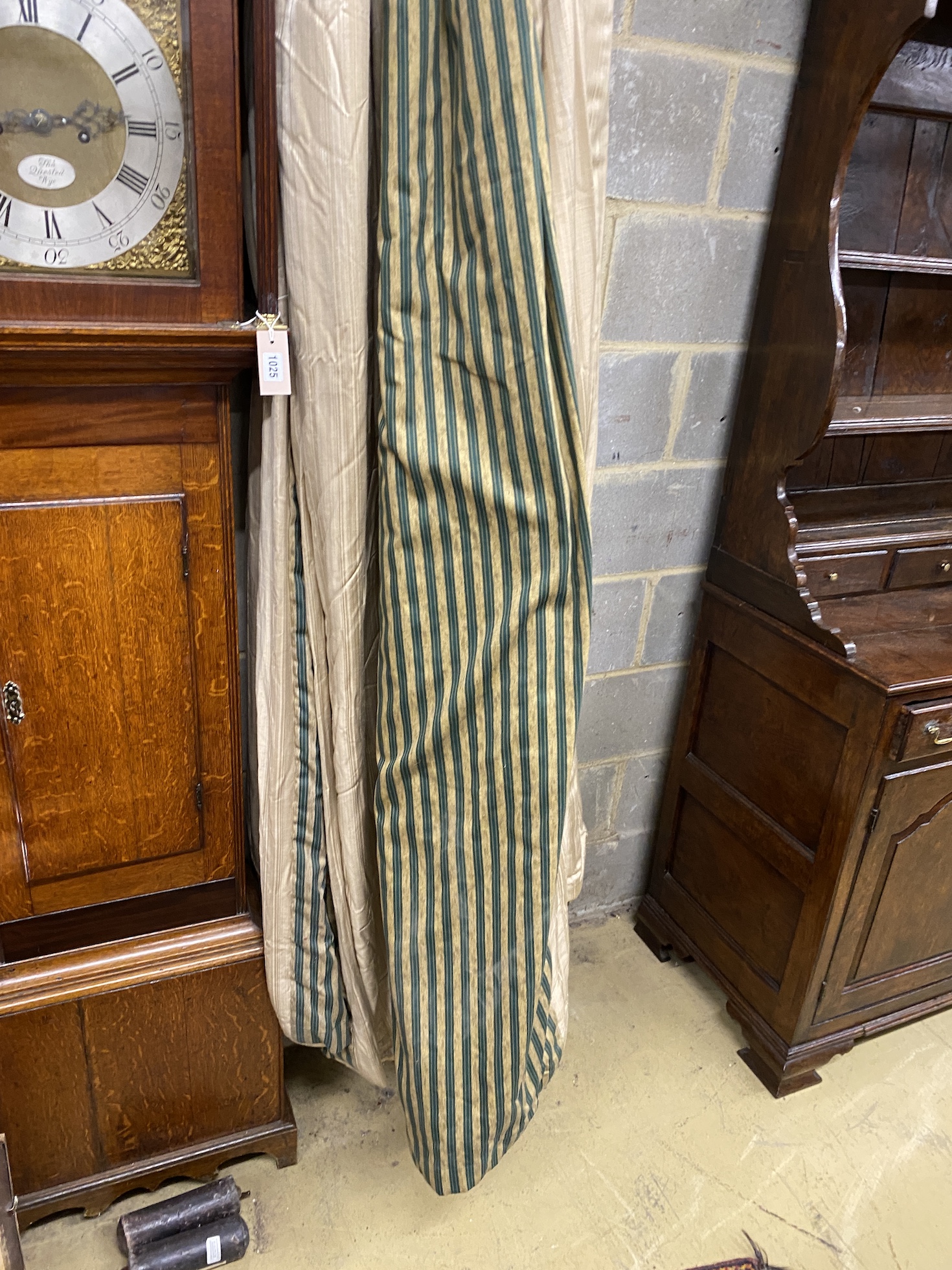A pair of gold striped curtains with green / gold striped linings, approximate widths 150cm top , 300cm floor, 240cm drop.